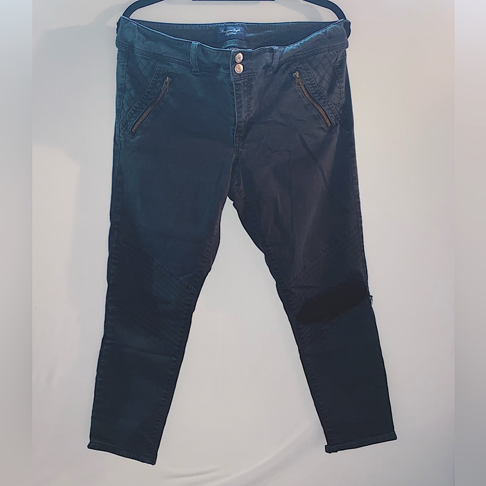 Black ribbed pants with hole in one knee